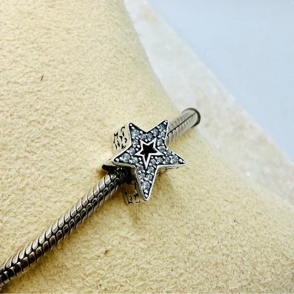 EUC Pandora 790016C01 Sterling Silver Asymmetric Star Charm w/ Clear CZ’s